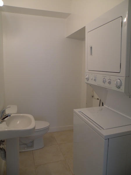 Laundry room with half bath